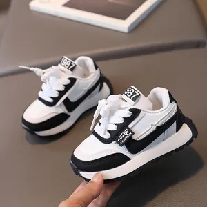 Classic black and white kids retro running shoes with thick non-slip soles for spring