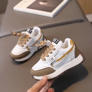 Kids vintage running shoes in white and brown leather with a 1987 retro sporty design