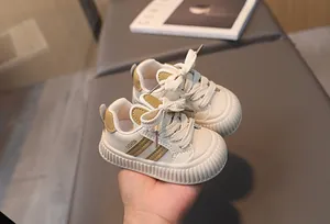 Detail of baby walking shoes with cute rabbit ear design and thick rubber non-slip soles