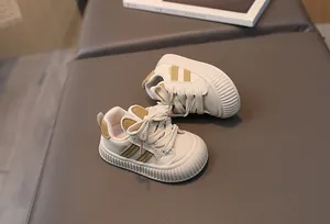 Detail of baby sneakers featuring a cute rabbit ear design and non-slip rubber soles