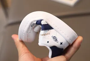 Flexible soft sole detail of white kids sneakers showing great bendability for comfort