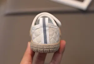 Detail of baby walking shoe showing quilted faux leather and non-slip rubber sole