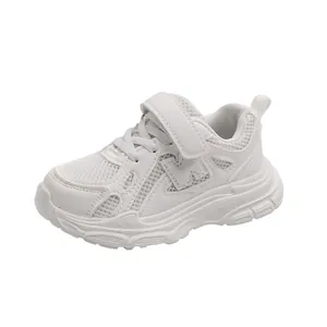 White breathable mesh sneakers for children with Velcro straps and non-slip soles