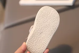Close-up of anti-slip rubber sole with size marking for toddler walking shoes