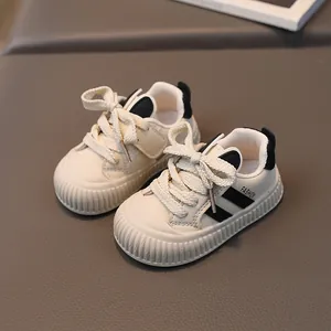 Toddler anti-slip sneakers in beige with black stripes and fashion lettering