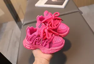 Detail of pink girls sports shoe featuring thick laces and durable non-slip thick sole
