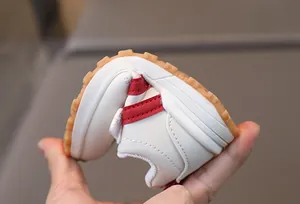 Flexible toddler sneakers with soft non-slip rubber soles and durable white leather
