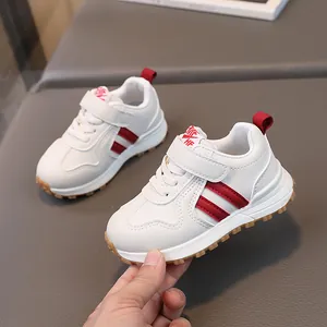White toddler sneakers with red stripes, faux leather upper and non-slip rubber soles