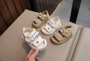 Close-up of summer baby sandals featuring cartoon bears and protective closed-toe design