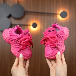 Chunky pink girls sneakers with Love lettering and sport tag on thick durable soles