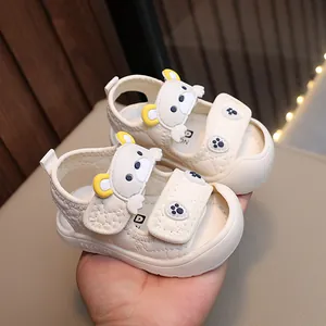 Beige baby boy sandals with 3D cartoon bear patterns and dual Velcro closure straps
