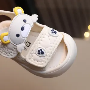 Infant cartoon bear sandals in cream white with soft quilted texture and thick rubber soles