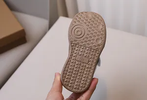 Detail view of anti-slip rubber sole with size engraving on kids athletic shoes