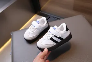 Detailed macro view of kids' leather sneakers with velcro closure and non-slip rubber sole