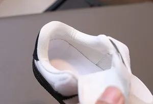 Detail shot of the breathable mesh lining and non-slip rubber sole of toddler sneakers