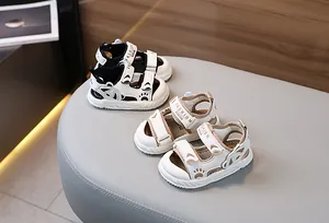 Detail of baby summer sandals featuring velcro straps and cute bear paw decorations