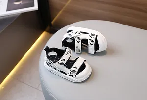 Detail view of toddler sandals with breathable upper and velcro strap showing the bear paw design