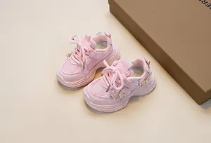 Detailed view of pink toddler sneakers with mesh upper and sparkling butterfly accent