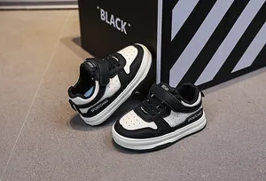 Close-up of kids sports shoes with velcro strap and breathable leather textures