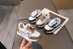 Detail of retro children's running shoes with thick rope laces and fashion labels
