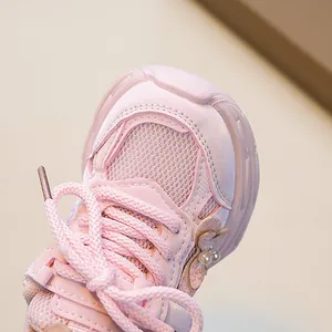 Pink girls sports shoes with breathable mesh and sequined butterfly pearl detail