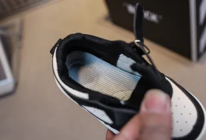 Detail of breathable mesh insole and velcro closure on children sneakers