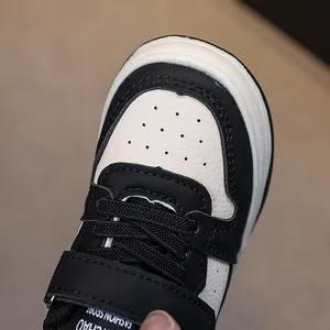 Toddler black and white leather sneakers with breathable toe cap and soft rubber sole