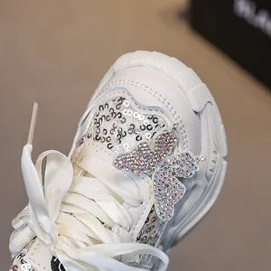 Sparkly white girls sneakers with sequined butterfly and colorful rhinestones