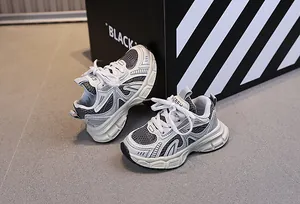 Detail of children's breathable mesh sneakers with chunky anti-slip sole and lace-up design
