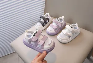 Close-up of toddler sandals with breathable mesh, double velcro straps and non-slip rubber soles