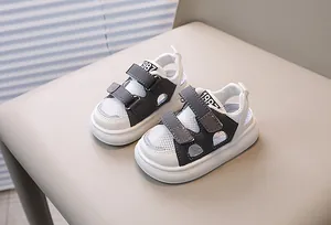 Detail of toddler sports sandals with breathable mesh cutouts and dual velcro straps