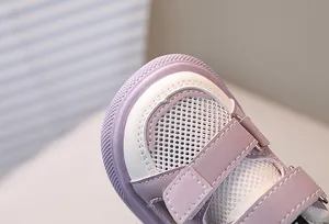 Detail of toddler mesh sandals with purple leather accents and breathable toe box