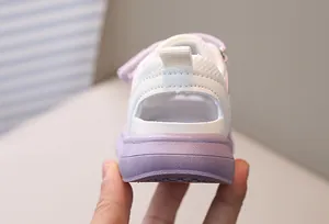 Macro detail of breathable mesh fabric and adjustable velcro strap on toddler sport sandals
