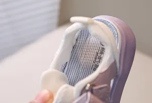Detail of breathable purple mesh lining and soft padded heel of kids walking sandals