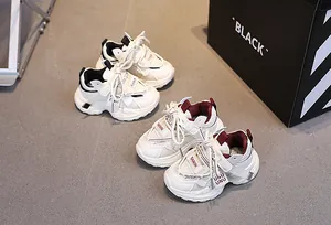 Detail of children's breathable mesh sneakers with hook-and-loop closure and non-slip soles