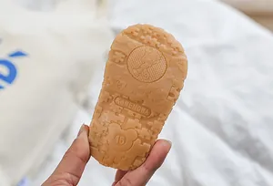 Detail view of flexible rubber anti-slip sole with puzzle pattern for baby walking shoes