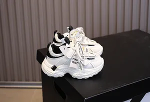 Detail of children's mesh sneakers with thick shock-absorbing soles and velcro straps