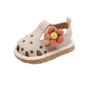 Sandales bébé fille beiges à pois avec fleur orange et semelle en caoutchouc souple