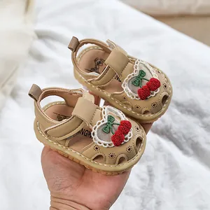 Beige baby girl sandals with cherry embroidery and lace detail for first steps