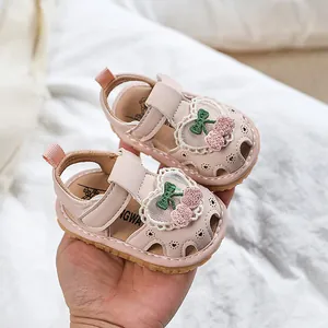 Pink infant girl sandals with cherry embroidery and soft non-slip soles for toddlers
