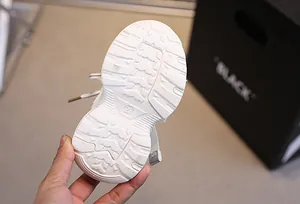 Macro detail of toddler sneaker sole with anti-slip thick grip and size 23 engraving