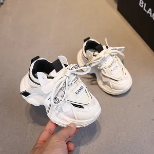 White breathable kids sneakers with black trim and anti-slip thick soles for 1-6 years