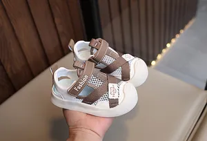 Macro shot of breathable mesh baby sandal with anti-slip rubber sole and velcro closure
