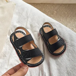Sandales en cuir noir pour bébé avec double scratch et semelles en caoutchouc antidérapantes