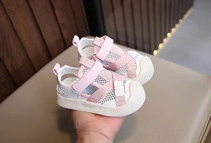 Detailed view of pink mesh toddler sandals with breathable fabric and Velcro straps