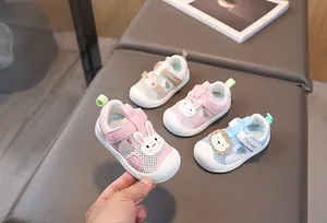 Detailed view of breathable mesh baby walking shoes with cute animal motifs and Velcro