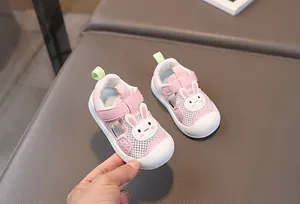 Close-up of pink breathable mesh toddler sandal with protective toe and bunny decor