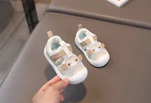 Detailed macro view of breathable mesh toddler sandals with cartoon animal toe protection