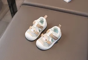 Macro shot of breathable mesh baby shoes with protective toe cap and velcro strap detail