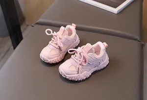 Overhead view of pink breathable mesh kids sneakers with non-slip rubber soles